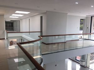 Curved Glass Balustrade with Wooden Handrail